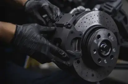 Brake pad and disc replacement service on a vehicle